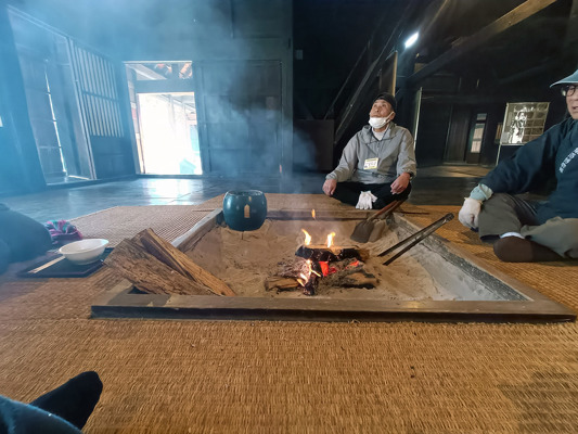 Storyteller around the fire (Irori)