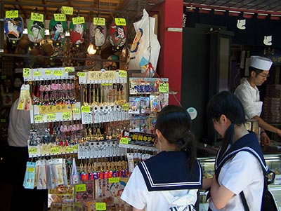 Schoolgirls buying keychains